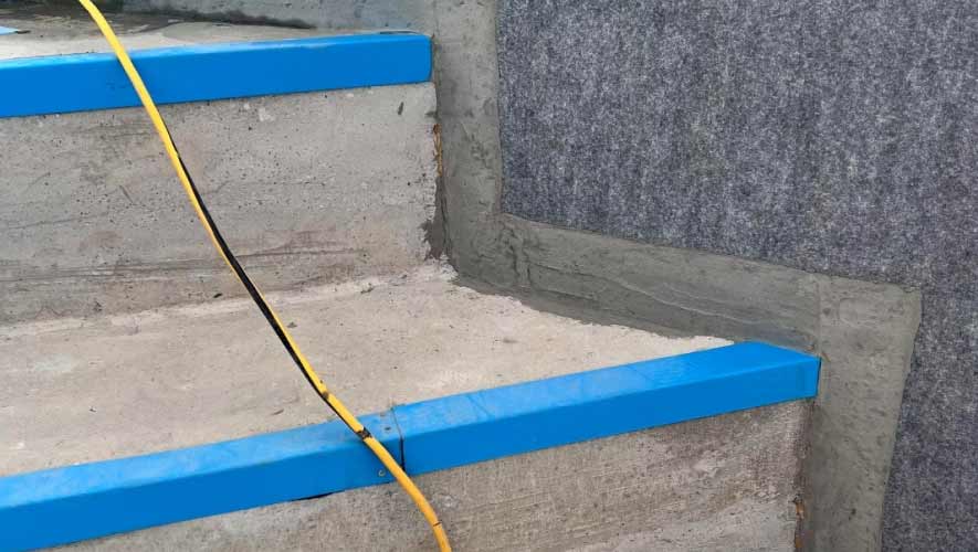 Blue-laminated-profile-and-geotextile-(on-wall) Blue Laminated Profile And Geotextile (On Wall)