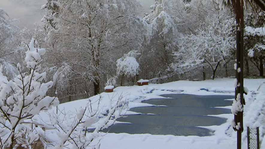 Covered-in-ground-pool-in-winter